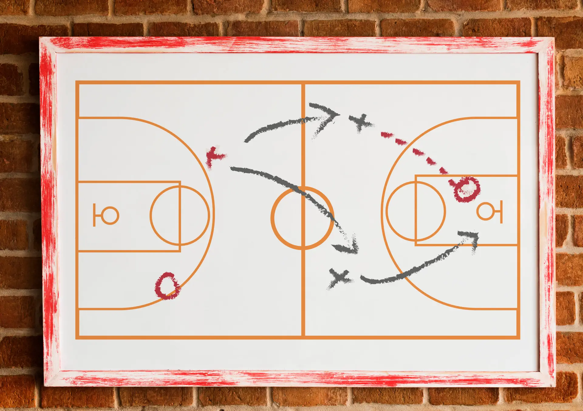 Hand held whiteboard showing basketball court with arrows and Xs depicting the team's tactics